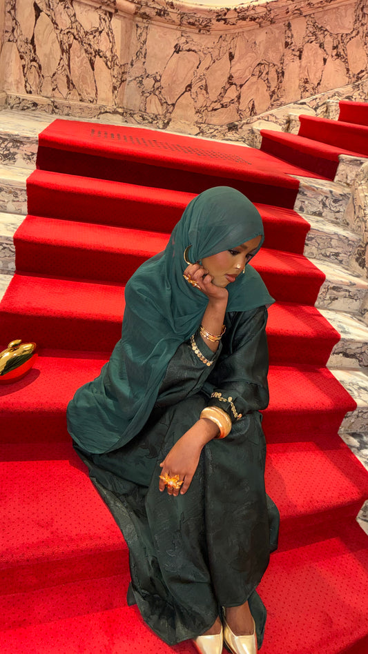 Teal Green Coin Abaya – teal green abaya on red carpet stairs