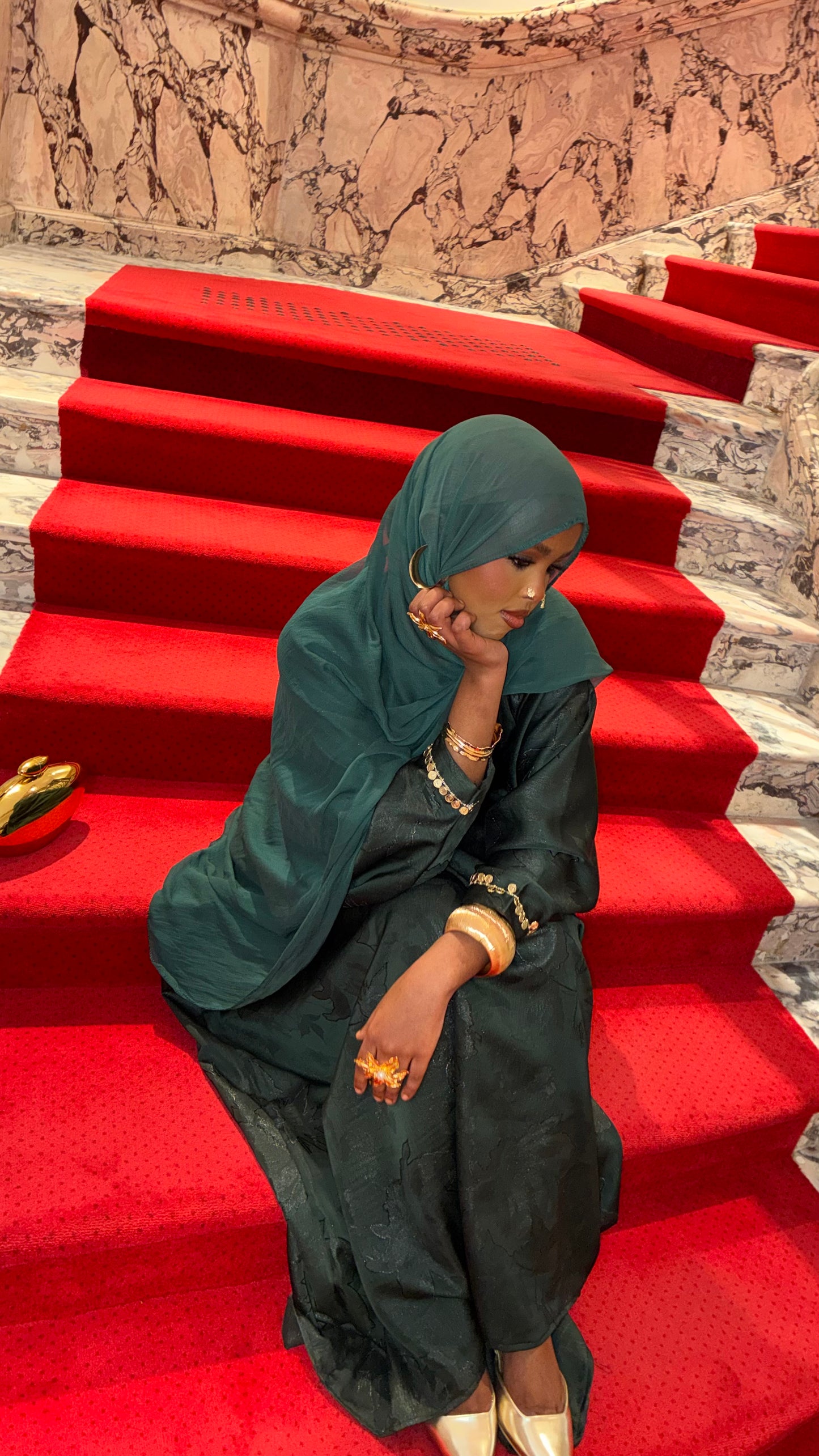 Teal Green Coin Abaya – teal green abaya on red carpet stairs